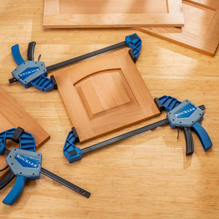 Clamping a panel with two one-handed bar clamps