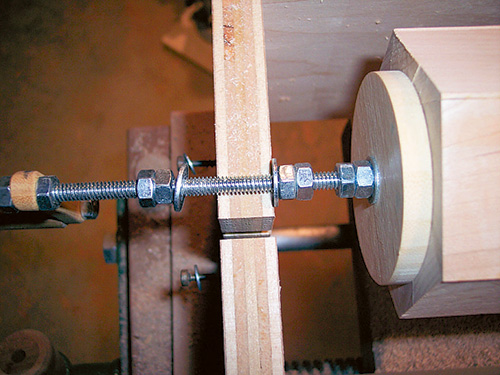 Rolling pin sleeve mounted in jig for shaping