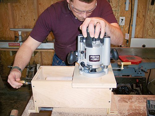 Routing grooves in a rolling pin using router slide and rolling pin jig