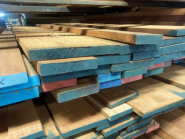 Marked rough-sawn boards on shelves