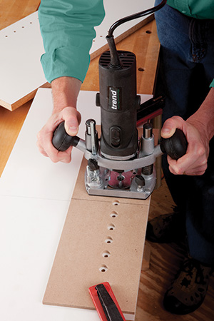 Drilling holes with a straight router bit