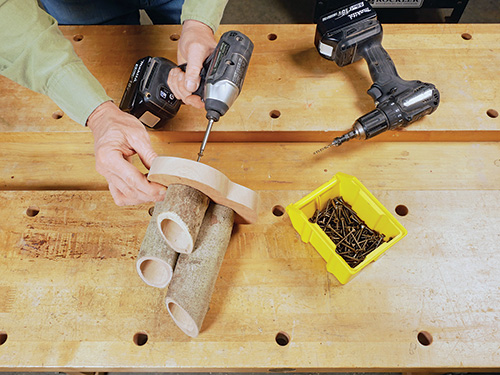 Fastening candle holders to base