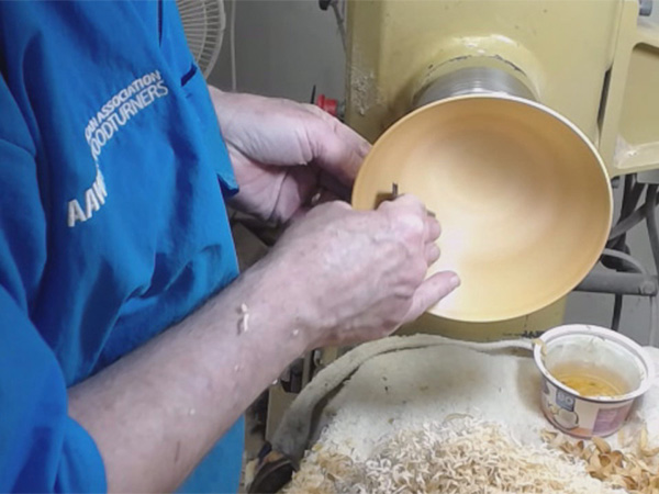 Sanding a bowl with water