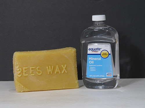 Beeswax bar and bottle of mineral oil