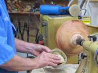 Using abrasive paste to lubricate woodturning project for sanding
