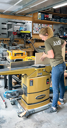 Sarah Listi running board through jointer