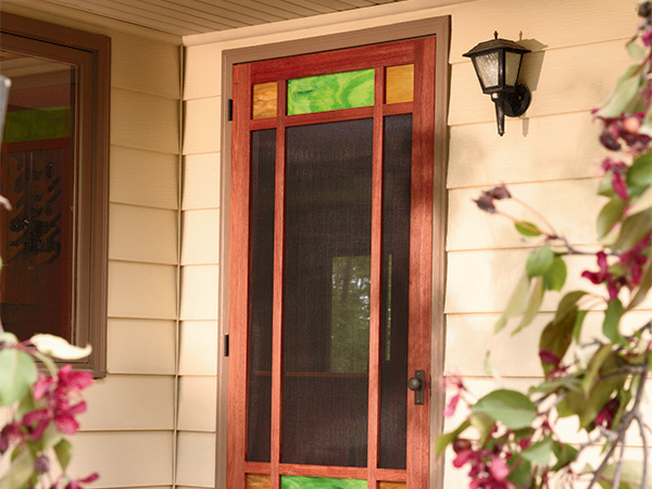 Exterior screen door with colored panels