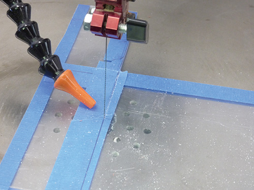 Cutting an acrylic sheet with a scroll saw and tape guide