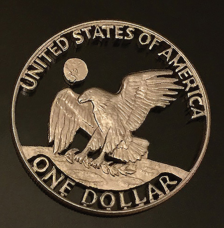 Eisenhower dollar cutout made with a scroll saw