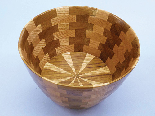 Scroll sawn bowl with uneven segments