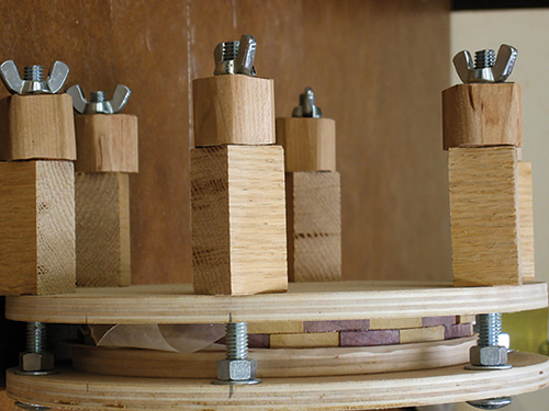 Holding bowl segments together in a bowl press