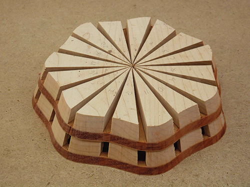 Scroll sawn bowl segments stacked together