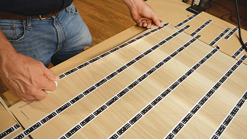 Applying Shaper Origin tape to game table blank