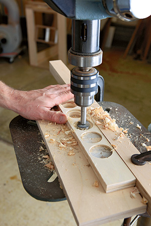 Drilling spaces for sharpening cart tool holder
