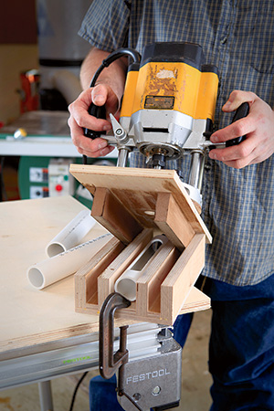 Cutting viewing holes in PVC pipes with routing jig