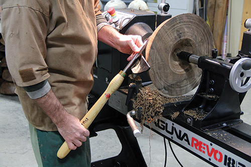 Holding bowl scraper against leg