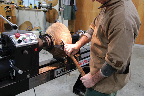 Scraping a bowl blank on a lathe