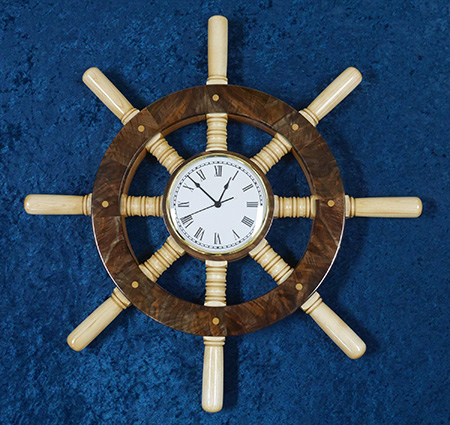 Turned ship wheel on blue background