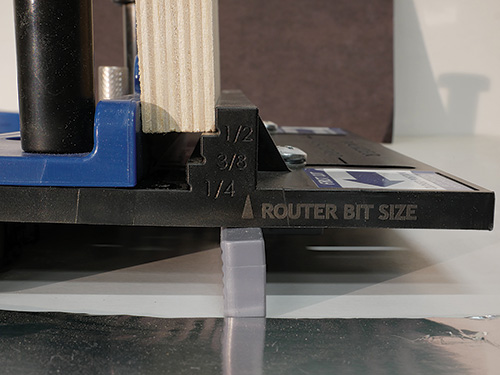 Close-up of dado plate router bit size gauge