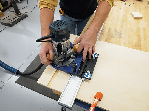 Making second reverse cut with router plate and rail