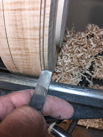 Using scraper to cut down bowl rim