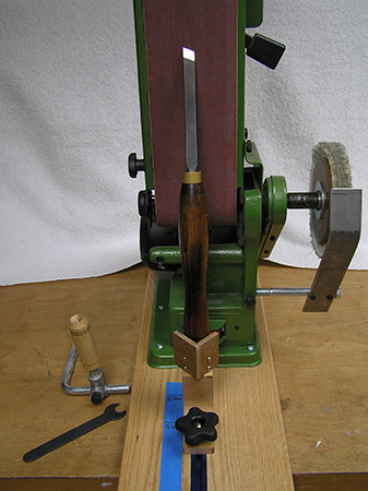 Belt sander set up to sharpen a skew chisel