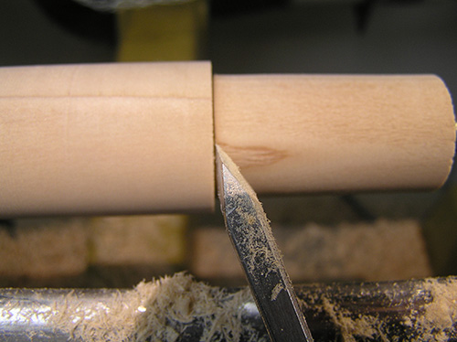 Close-up of completed paring cut and skew chisel