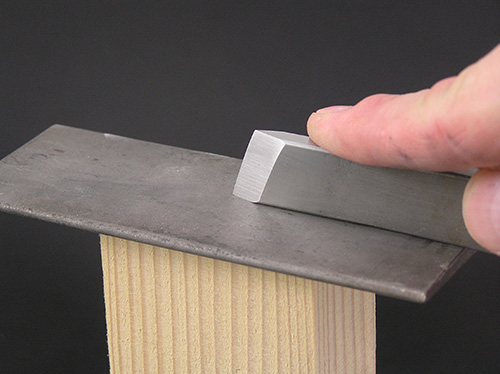 Sharpening one edge of a rectangular skew chisel