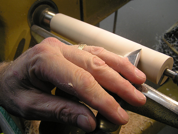 Cutting a woodturning blank with a skew chisel