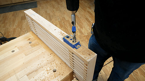 Using shelf support drilling jig to install rod holes