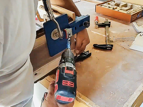 Using a jig to guide dowel hole cuts