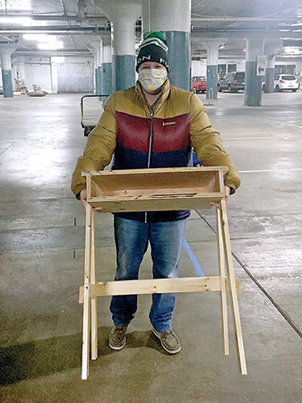 Colleen Carey shows a desk that she built