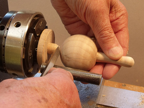 Cutting spoon turning blank off at top of turning