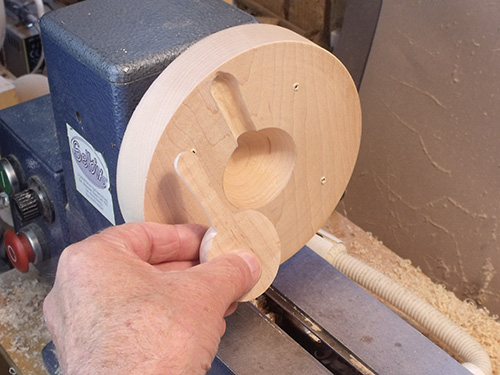 Spoon shape carved into lathe chuck