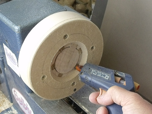 Spreading hot glue through MDF chuck cover