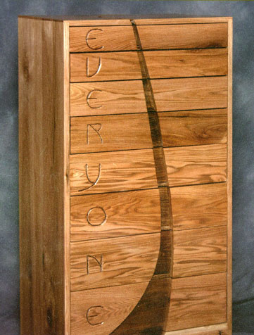 Letterdresser: Junior Cliff Bailey combined his talents from woodworking and English class on this butternut and walnut dresser: the outside of each drawer features the first letter of each line of a poem which appears on the drawer spacers.