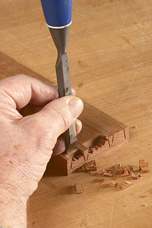 Cutting out dovetail pins with a chisel