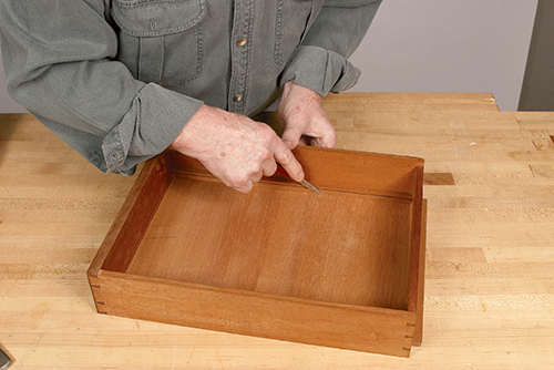 Marking drawer bottom shoulder with knife