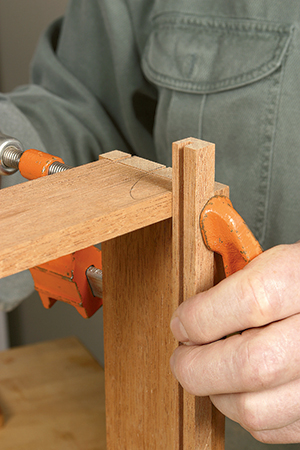 Clamping drawer slip to carcass