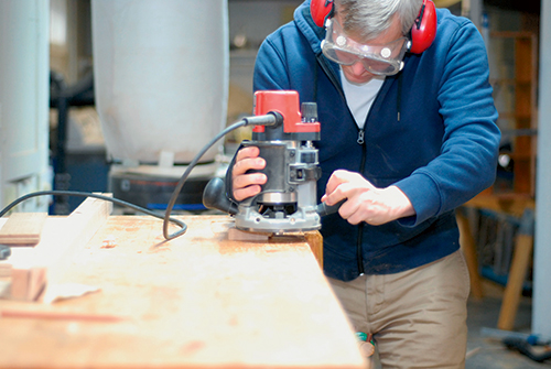 A rabbeting bit makes quick work of the corbels’ stub tenons. Make a pass on one face, flip the workpiece over, and complete the tenon with a second pass.