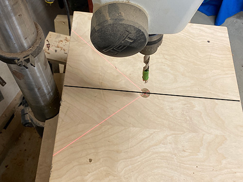 Center jig on drill press table