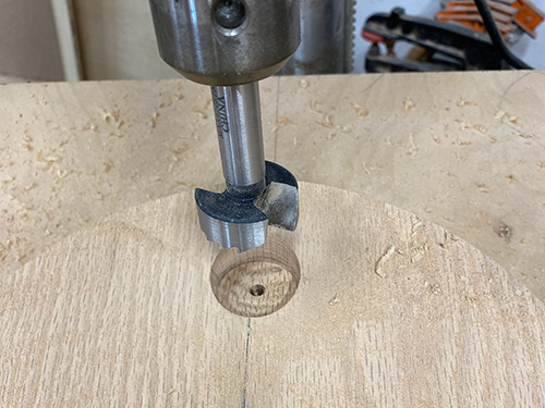 Creating hole in stool seat for installing legs
