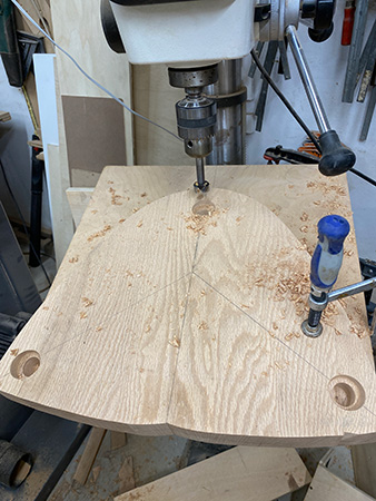 Stool seat blank with all three leg holes drilled