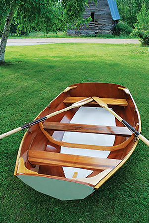 Completed epoxied mahogany boat hull