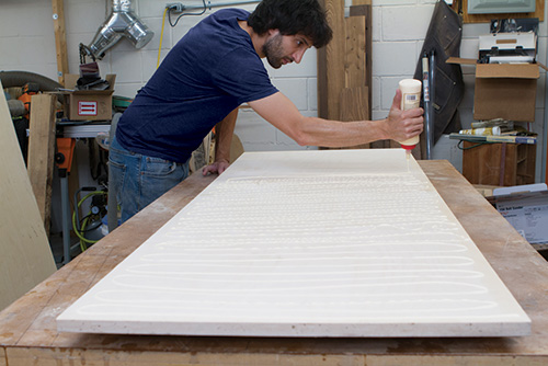 Adding glue for creating laminated tabletop for outfeed table