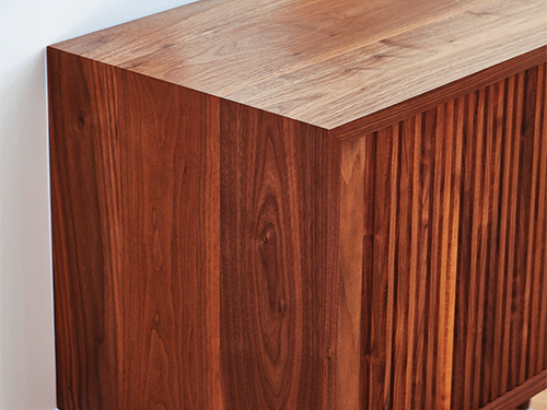 Waterfall joinery on a tambour console cabinet
