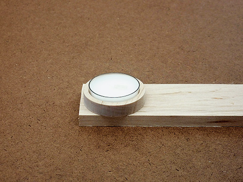 Tea light sitting in cut out collar