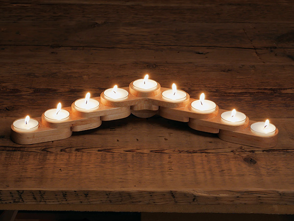 Lit menorah using tea light candles