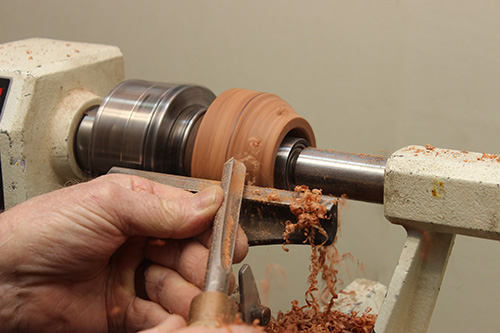 Turning top portion of candleholder