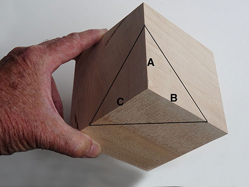 Cube marked for cuts on a lathe